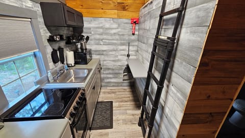 on the right in the kitchen, little bar that folds down, stairs to the loft.