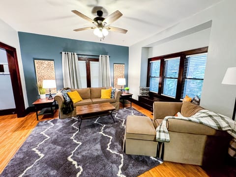 Living Room with Queen Sofa Couch and Smart TV.