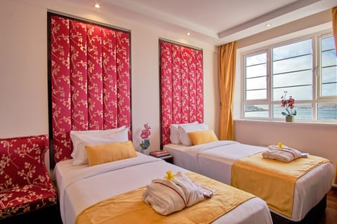 Wake up to golden light and calming seaside views.