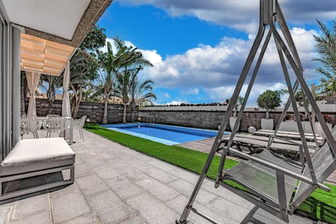 Relaxing area just outside of the living room patio doors with a rocking chair