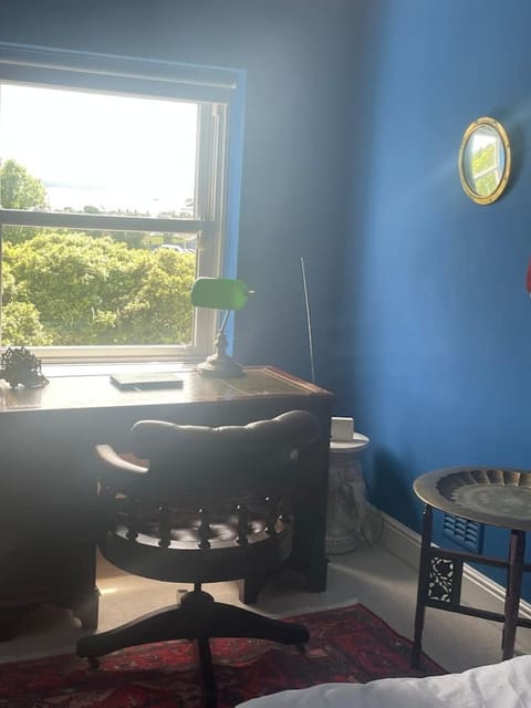 Second Bedroom with double bed and desk overlooking the common