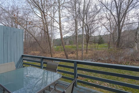 Private balcony with serene woodland views—an inviting spot for morning coffee or evening wine.