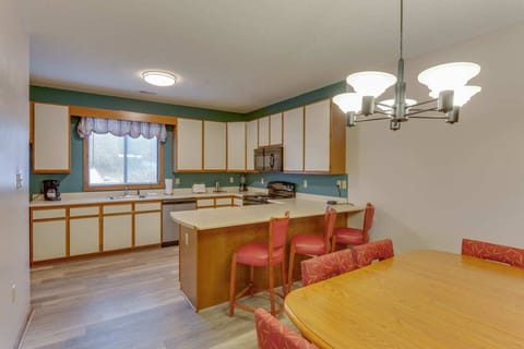 Spacious kitchen and dining area with full-size appliances—great for home-cooked meals and gatherings.