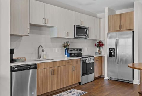 - Open kitchen with modern appliances perfect for cooking during your stay
- Bright counters and clean layout offering convenience and comfort
- Ideal rental near downtown with easy travel access