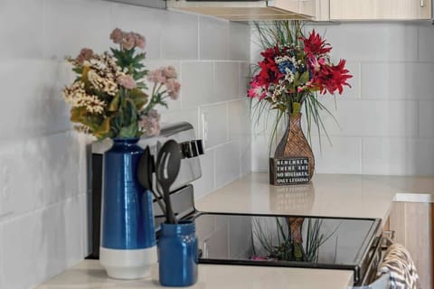 - Floral décor and modern kitchen vibe  
- Bright space with stylish touches  
- Perfect details for an inviting stay  