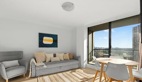 bright, open-plan living room with a gray sofa