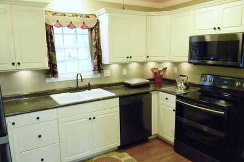 Kitchen view #2 with sink, dishwasher, double oven, cooktop, microwave, grill...