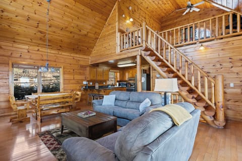 High vaulted ceilings open up the space, making the living area feel grand while maintaining a relaxed, inviting vibe.