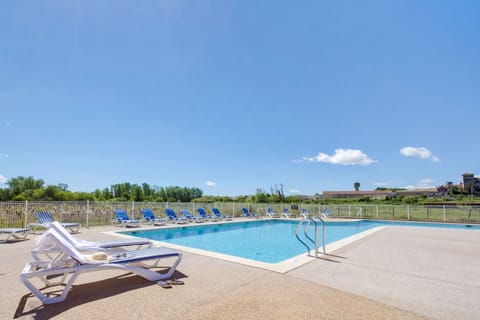 Lounge by the pool in the sunshine.