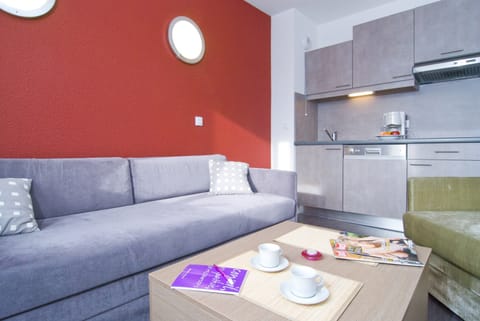 Prepare meals in the kitchenette and enjoy them at the dining table.