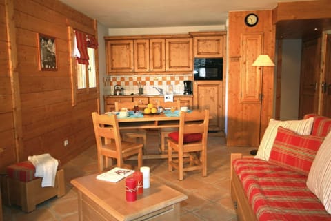 Prepare meals in the kitchenette and enjoy them at the dining table.