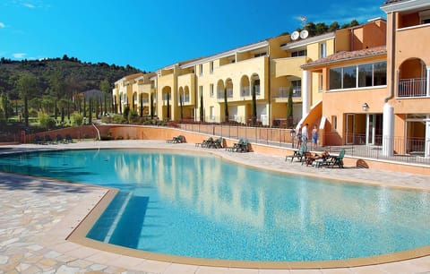 Lounge by the pool in the sunshine.