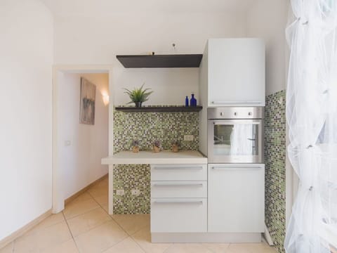 Kitchen, Interior Design, Countertop, Flooring, Kitchen Appliance, Major Appliance, Floor, Cabinetry, Lighting, Home