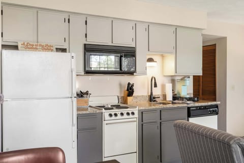 The open kitchen offers ample storage & every home comfort