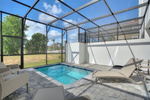 Relaxing Poolside Retreat with Enclosed Lanai