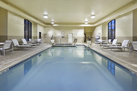 Take a refreshing dip in the indoor pool, surrounded by inviting lounge chairs for relaxation.