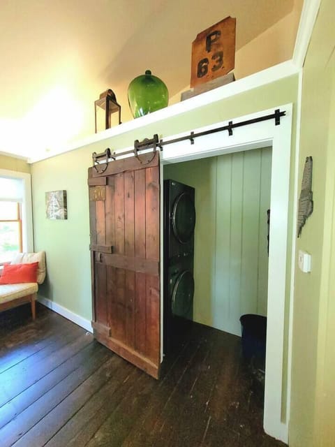 Mud room entry with washer dryer slider open.