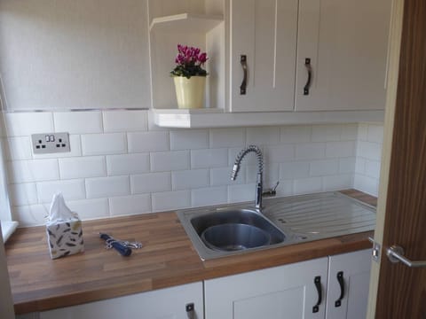 The Utility area which has washer and dryer machine.