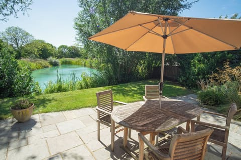 The patio area overlooking one of our fishing lakes. This patio and garden area is fenced.