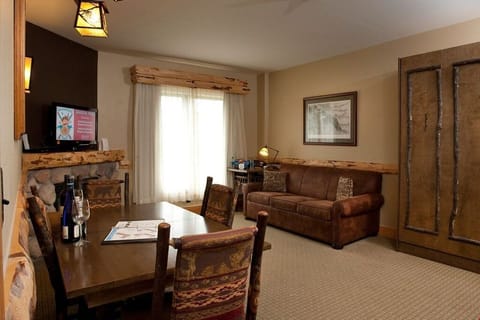 Relax in the gorgeous open-concept living space and light a fire to warm up after a day in the mountains