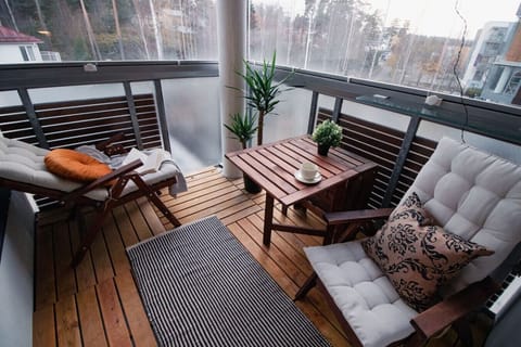 Step outside to your cozy balcony and enjoy the peaceful forest views.