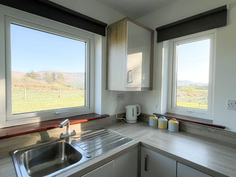 Honeybee Cottage Valentia Co Kerry.  Bright kitchen with views to garden.