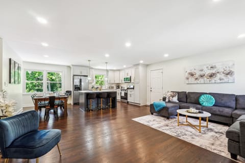 MainLevel Open Concept: Living Room with 75" Smart TV & Garage access