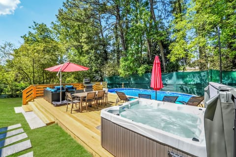 Fully fenced-in Backyard with private pool deck including dining table,BBQ grill