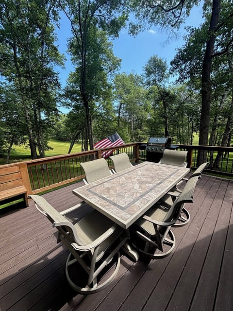 Large deck overlooking golf course w/ lots of seating & gas grill