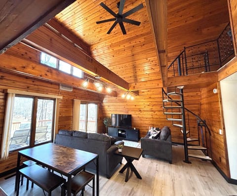 Open concept living area w/ steps up to loft. Picnic-style dining table for 6