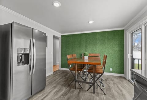 The dining area opens to the backyard, bringing the outdoors in.