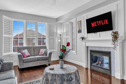 Spacious living room ☀️ Smart TV & fireplace ✨ Bright, cozy & perfect to unwind!