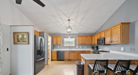 Large kitchen with breakfast bar seating for 3