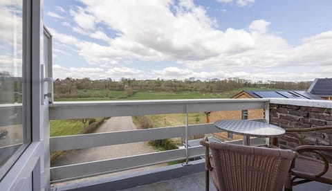 Balcony. Exact unit will be assigned upon arrival. Views, colors, and decor may vary.