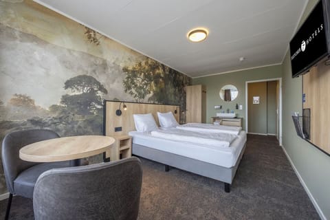 Unit with 2 Single beds. Exact unit will be assigned upon arrival. Views, colors, and decor may vary.