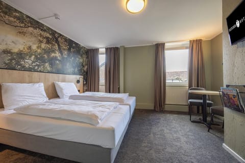 Unit with 2 Single beds. Exact unit will be assigned upon arrival. Views, colors, and decor may vary.