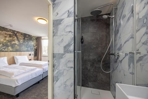 Unit with 2 Single beds. Exact unit will be assigned upon arrival. Views, colors, and decor may vary.