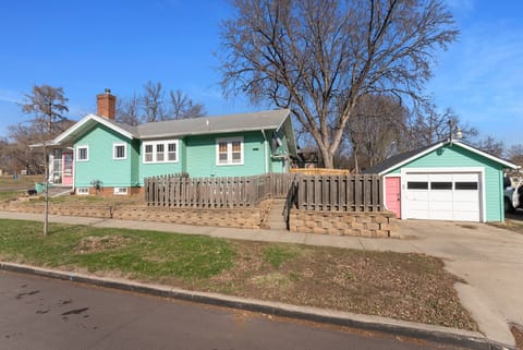 Guests can park along the street or in front of the garage, then enter up the steps and through the gate to the back patio.