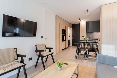 Experience modern comfort in this stylish living area, featuring sleek furniture and a cozy atmosphere perfect for relaxation.
