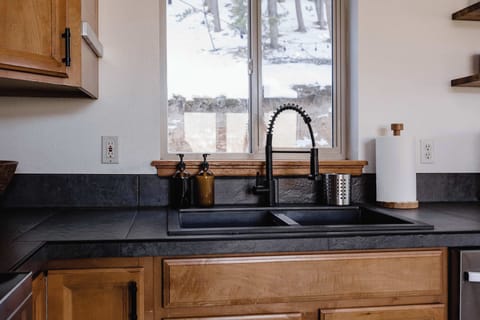 Paper towels, kitchen towels, dish soap and dish pods are included.