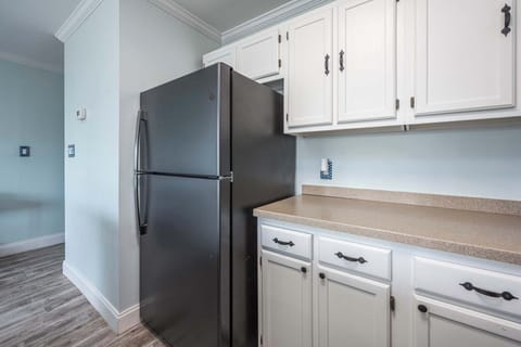 The open, airy kitchen offers ample space & every home comfort