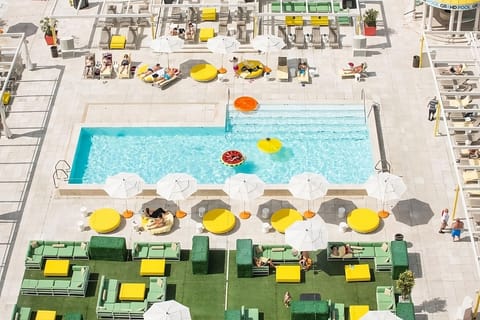 Soak up sunshine poolside with loungers, umbrellas, and sparkling water.