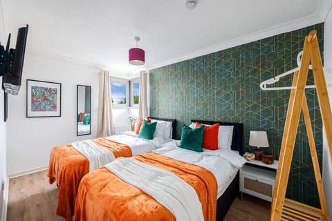 Bedroom one features a zip link bed, set up as two single beds by default or can be zipped together as a king-size bed upon request.