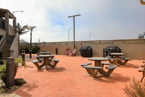 Fire up the flavor! Two gas grills, plenty of seating & coastal vibes for the ultimate BBQ hangout.