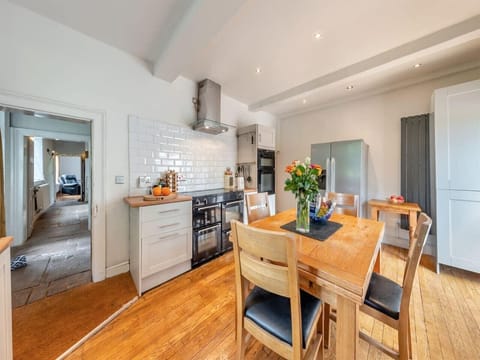 Open-plan kitchen with wood floors