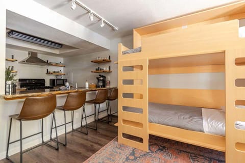 This space is highly efficient—bar seating for four makes dining easy, while murphy bunk beds maximize sleeping capacity without taking up extra room, perfect for compact yet comfortable living.