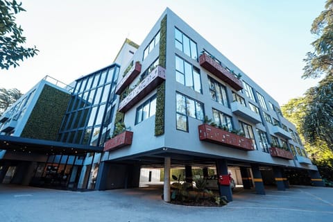 Arrive in style at a modern, design-forward hotel façade.