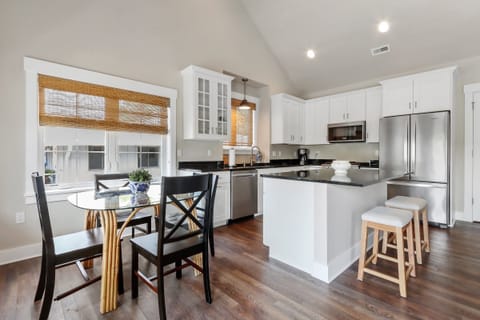Open concept kitchen and dining table.