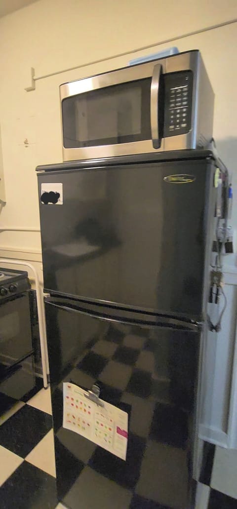 Full-sized stove, refrigerator and microwave.