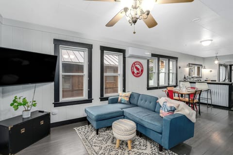 Lounge out on the cozy furnishings including a sectional sofa and Smart TV. | Main Level